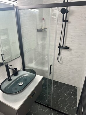 Shower, hair dryer, towels, soap