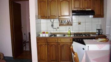 Apartment (One-Bedroom Apartment With Sea View a) | Private kitchen | Fridge