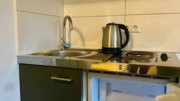 Fridge, microwave, stovetop, coffee/tea maker