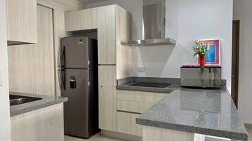 Fridge, microwave, stovetop, cookware/dishes/utensils