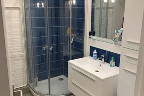 Shower, hair dryer, towels, soap