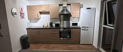 Appartamento | Cucina privata | Frigorifero, microonde, forno, piano cottura