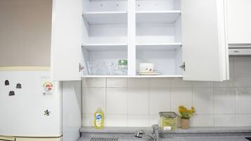 Fridge, microwave, electric kettle, cookware/dishes/utensils