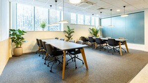 A conference room with a long table, multiple chairs, and pendant lighting. - Student Only Straits Manor (Sheffield)