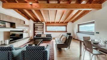 Apartment, Mountain View | Living area | 30-inch TV with digital channels