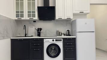 Apartment, City View | Private kitchen | Fridge, microwave, cookware/dishes/utensils