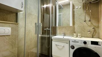 Shower, hair dryer, towels, soap