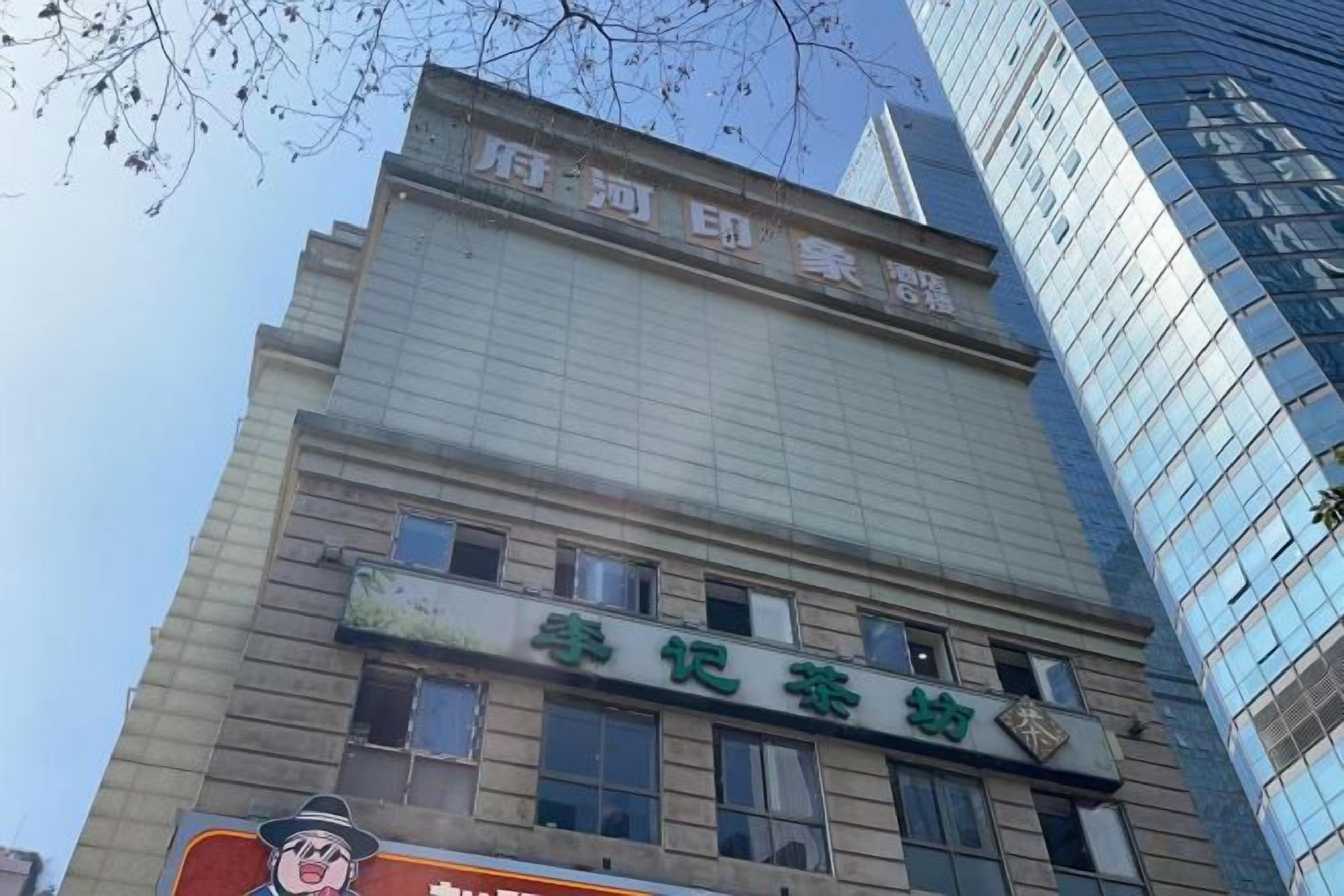 A building with a sign that reads 'Hotel'.