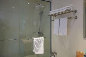 A glass-enclosed shower with a handheld showerhead, a glass door, and a towel rack with two towels. - Lanshan Hostel (Shanghai)