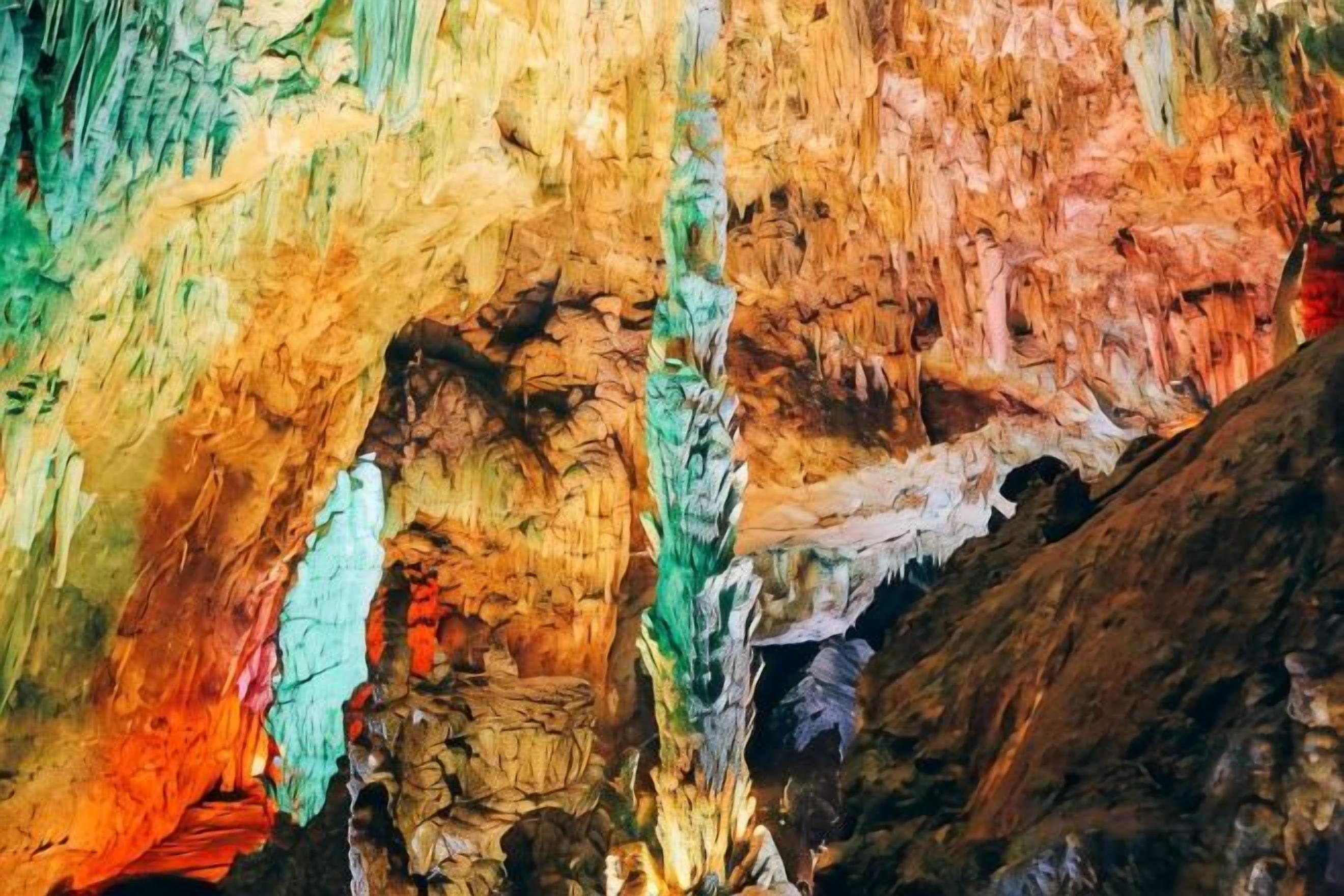 A cave interior with stalactites and stalagmites.