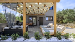 A modern outdoor patio with a pergola, seating area, and a small pool. - Rosy Villas Collection, for up to 20,  2 Pools & Jacuzzi (Anopolis)