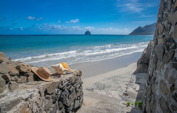 On the beach, white sand, beach towels, beach massages