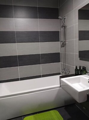 Shower, hair dryer, towels, soap