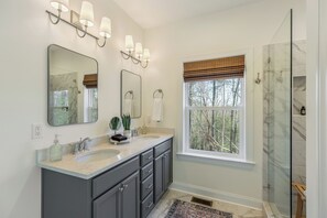 Shower, hair dryer, towels, toilet paper