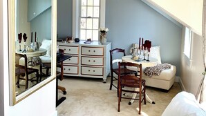 A bedroom with a sloped ceiling, a large mirror, a dresser, a chair, a bed, and a window. - Charming Grand View/Lake Loft in Brewster with WiFi, AC (Brewster)