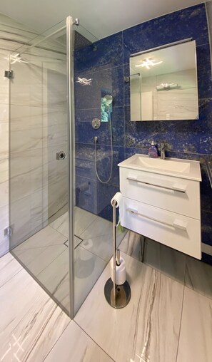 Shower, hair dryer, towels, soap