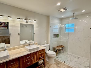 Shower, hair dryer, towels, toilet paper
