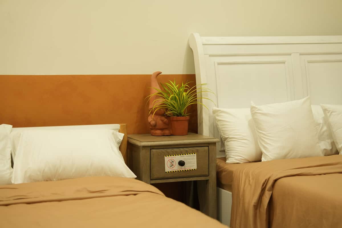 Deluxe Triple Room, Garden View | In-room safe, desk, laptop workspace, blackout drapes