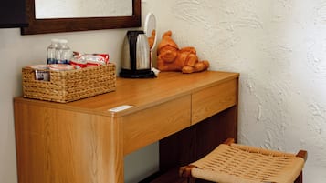 Deluxe Triple Room, Garden View | In-room safe, desk, laptop workspace, blackout curtains