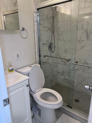 Shower, towels, soap, toilet paper