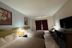 Desk, laptop workspace, blackout drapes, iron/ironing board - Coratel Inn and Suites by Jasper Wesley Hospital (Wichita)