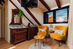 Deluxe Room, Balcony, City View | Living area | 48-inch Smart TV with digital channels