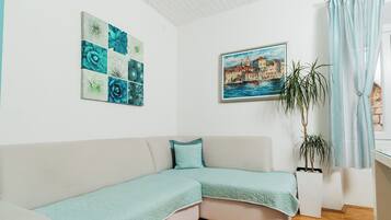 Classic Apartment, City View | Living area | 48-inch Smart TV with digital channels