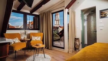 Deluxe Room, Balcony, City View | Living area | 48-inch Smart TV with digital channels