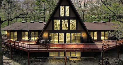 Spacious A-Frame sleeps 25 on 5 wooded acres with a private fishing pond