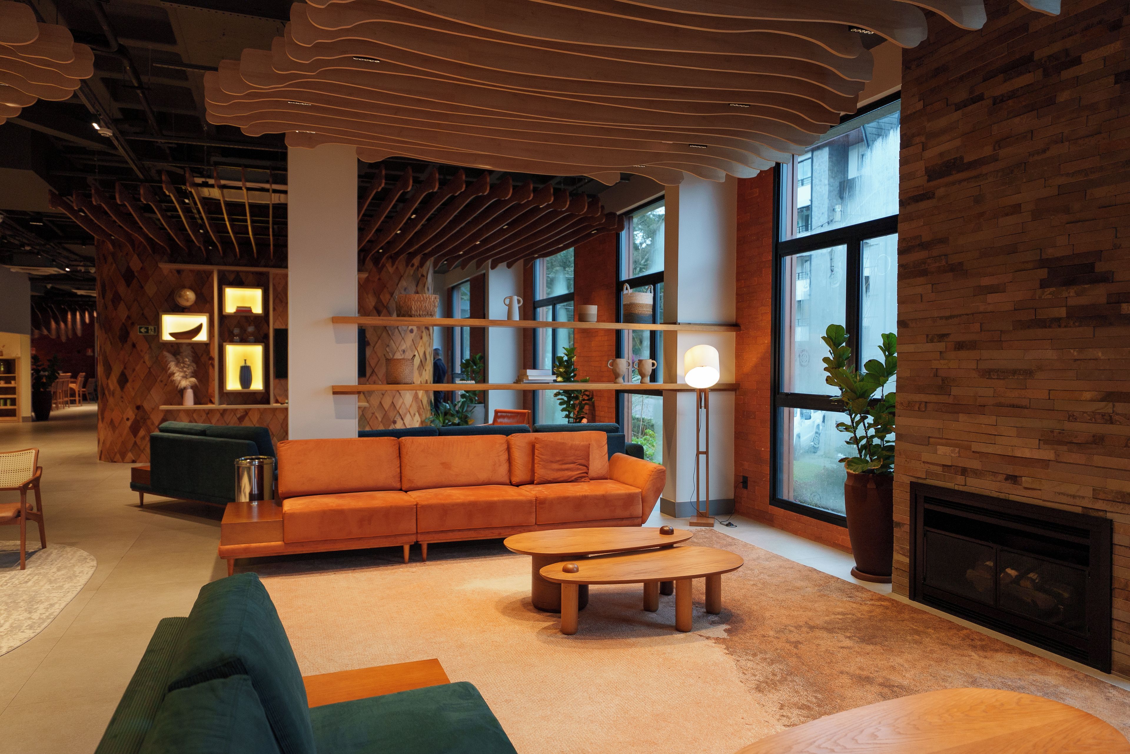 A modern interior with a sofa, coffee table, and a fireplace.
