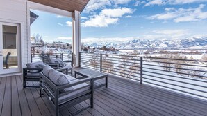 A covered outdoor deck with a view of snow-covered mountains. - Mountains and Horses and Deer, Oh My! (Heber City)