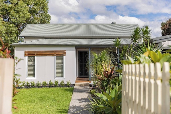 Surrounded by lush lawn and greenery, this single-level home offers privacy, essentials, and easy access to some of the region’s pristine beaches, shopping, and nature.