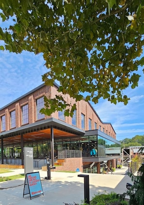 A modern building with a brick facade and large windows.