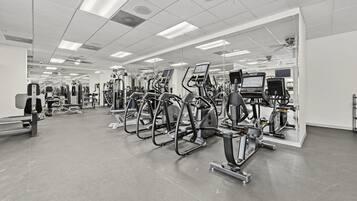 Modern fitness centre with sleek equipment and floor-to-ceiling mirrors