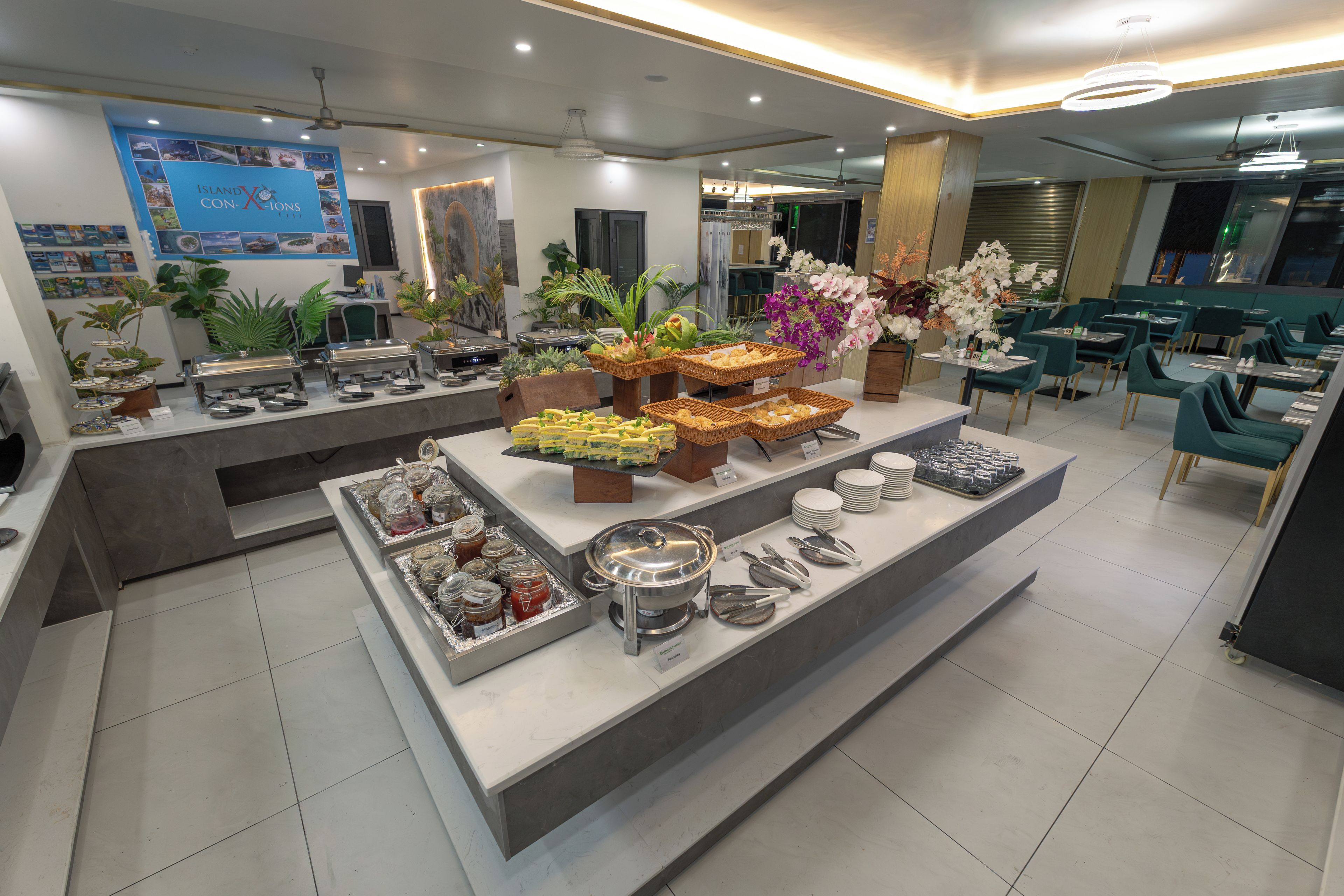 A buffet area with various food options, including sandwiches, fruits, and condiments.