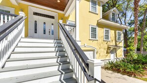A two-story house with a white staircase and a balcony. - 5 Mi to Beach: Spacious Home on Hilton Head Island (Hilton Head Island)