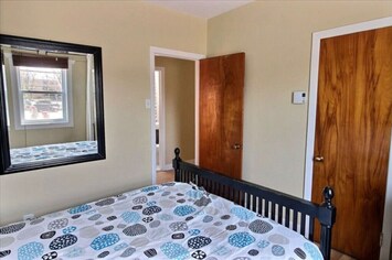 Quiet Montreal bedroom for restful sleep. Fresh bed linens and extra pillows provided.