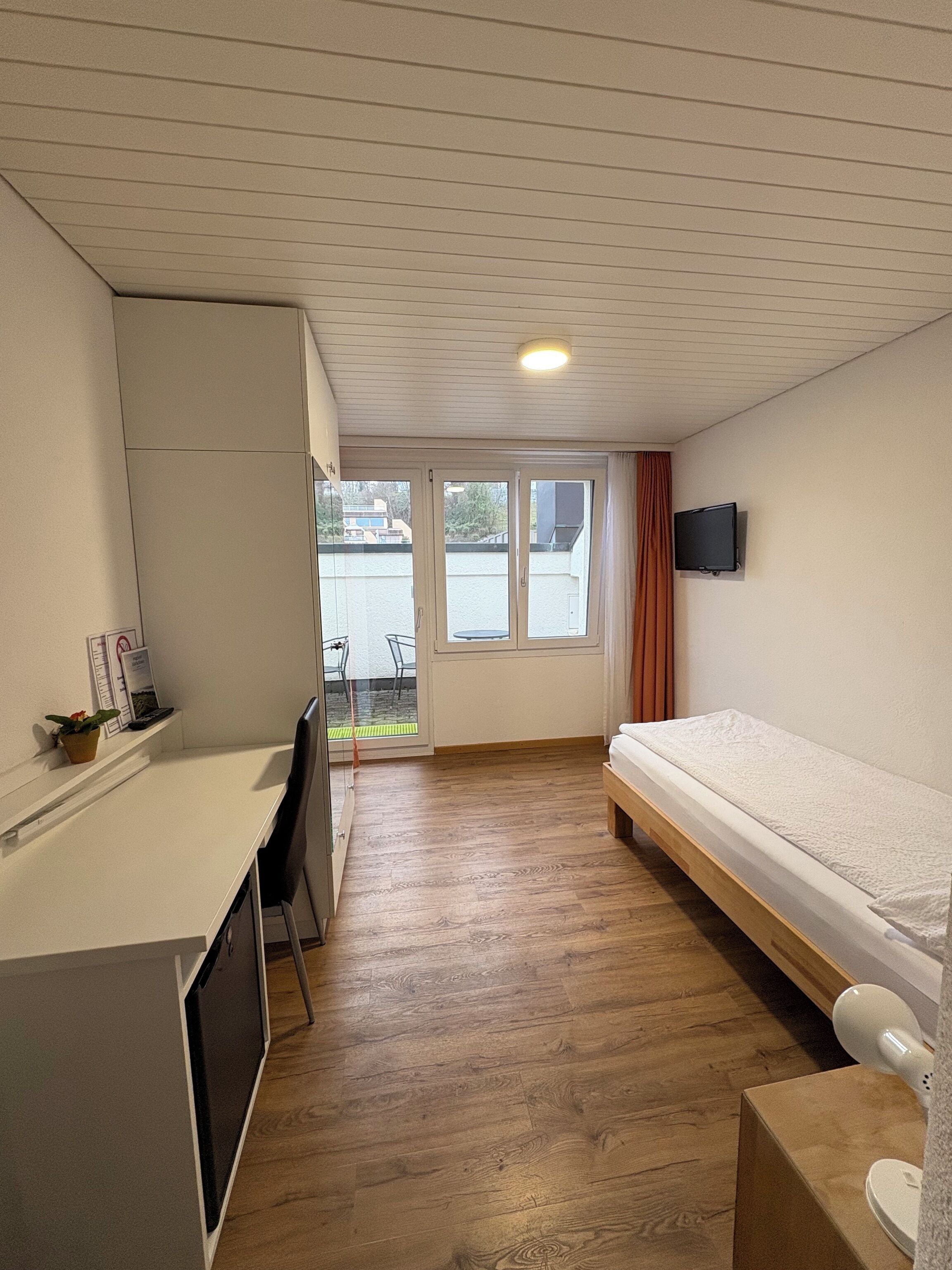 Desk, laptop workspace, free WiFi, bed sheets