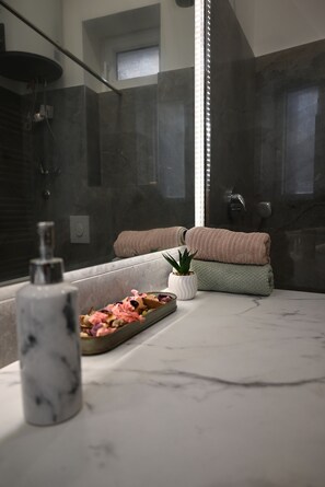 Shower, hair dryer, towels, soap