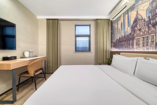 A hotel room with a bed, a desk, a chair, a window, and a wall-mounted TV. - JJ Hotel (Shanghai Nanxiang Guyi Garden Branch) (Shanghai)