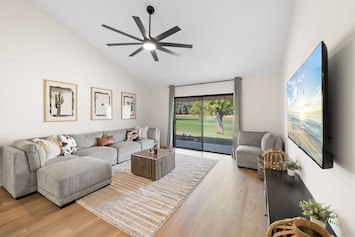 living room with golf course view