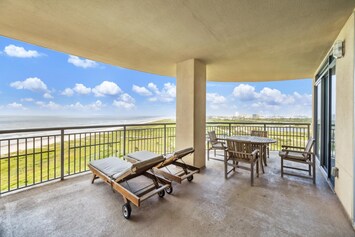 Beach balcony offers unobstructed views to the West, Pleasure Pier, sand, surf and city lights at night