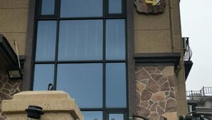 A building with large windows and a stone facade. - Fallen Bay (Shengsi)