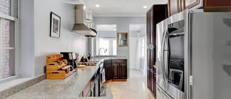Coffee/tea maker, fridge, microwave, oven