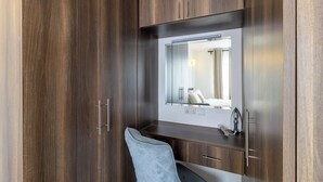 A modern bathroom with wooden cabinetry, a mirror, and a vanity with a sink. - Spacious 3-bedroom apartment with WiFi, swimming pool in vibrant Tatu City (Tatu City)