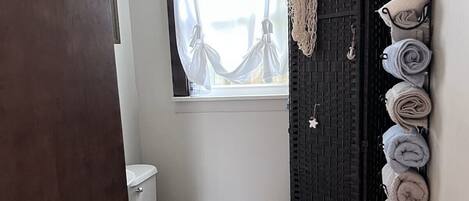 Shower, hair dryer, towels, soap