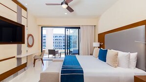 A hotel room with a large bed, a flat-screen TV, a desk, and a chair. - One Bedroom Suite Pool View, Los Cabos, Villa la Valencia Resort (San José del Cabo)