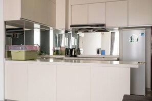 Family Apartment, City View | Private kitchen | Fridge, microwave, stovetop, dishwasher - Yue Tai Apartment City Center by Soben (Phnom Penh)