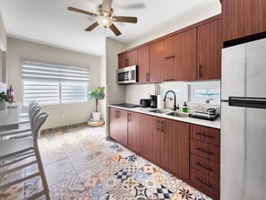 Fridge, microwave, stovetop, coffee/tea maker