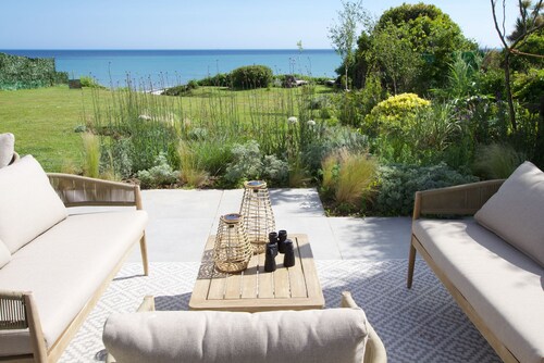 Downderlin is a light-filled beautiful home with a large garden that rolls directly onto the beach.
